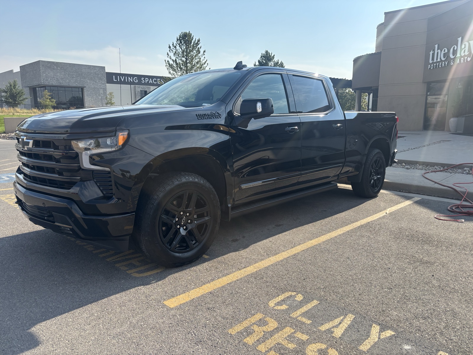 Black Chevrolet Silverado High Country side after exterior detail
