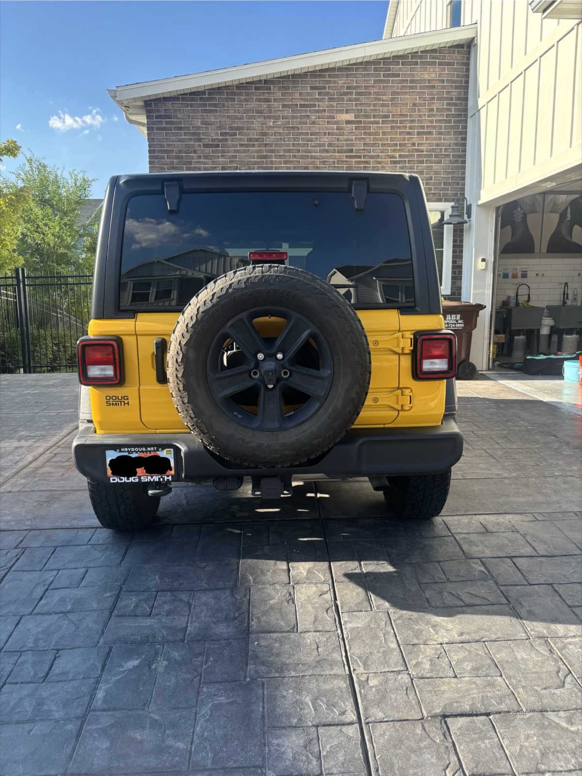 Yellow Jeep Wrangler after exterior wash