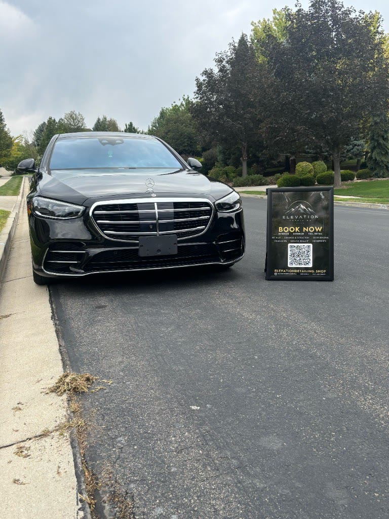 Black Mercedes S-Class after detail with Elevation Detailing sign